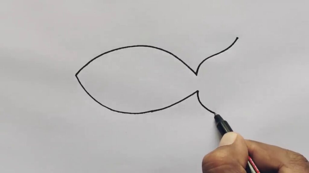 Fish drawing with an added eye and a smiling mouth.